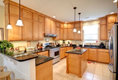 beautiful upscale kitchen with maple cabinets