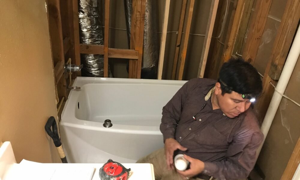 working on plumbing in a confined space